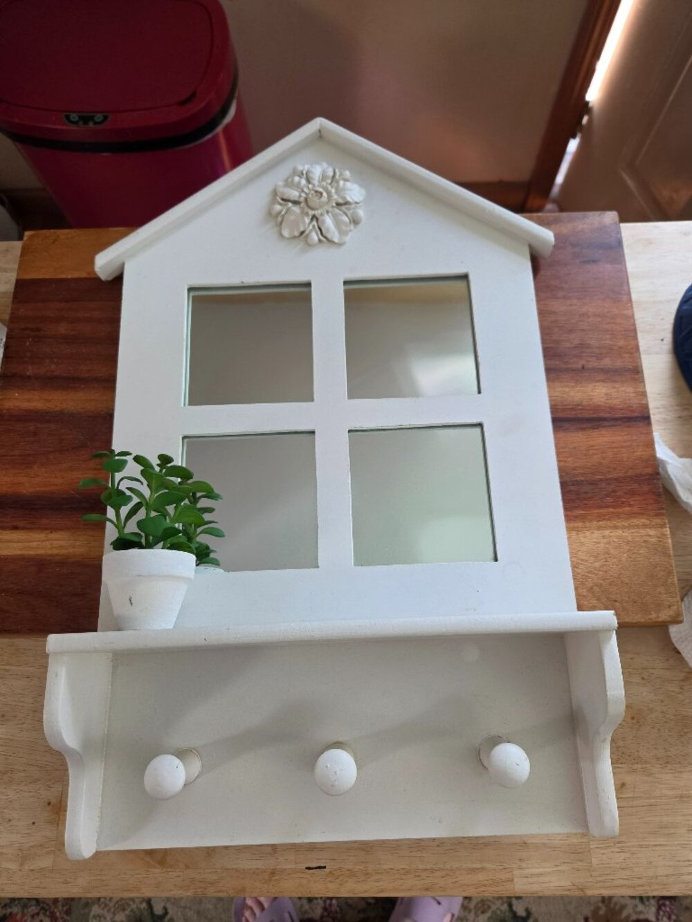 white wooden wall mount house shape frame with mirrors a shelf and hooks